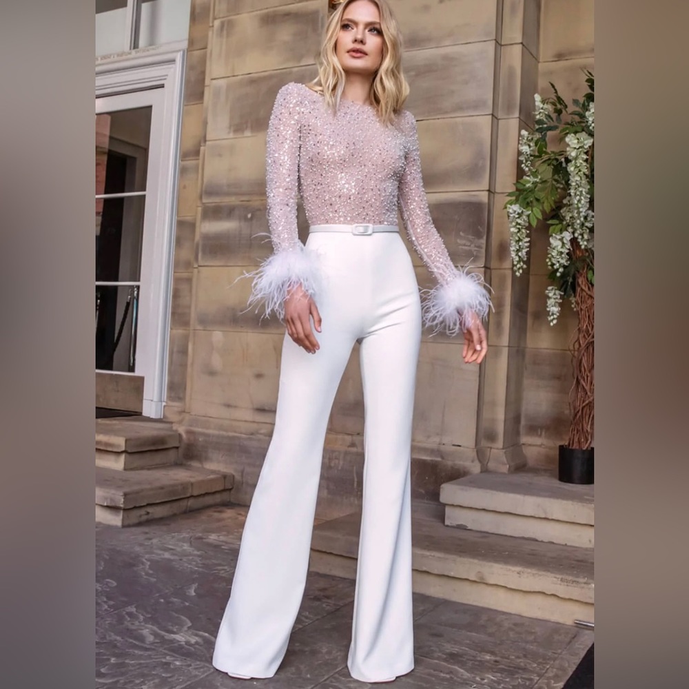 Amazing feather trimmed jumpsuit! Perfect for winter brides!